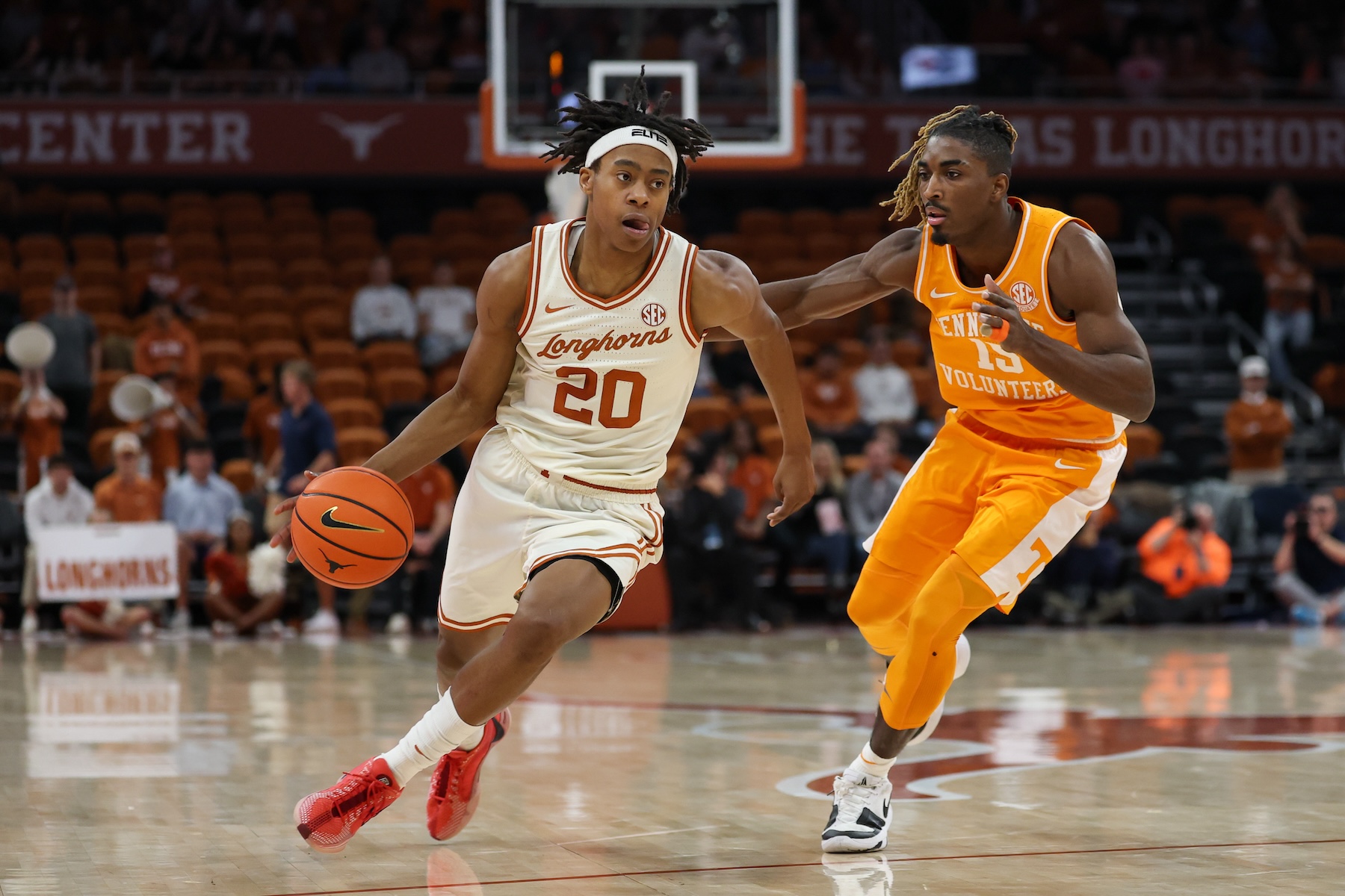 Tre Johnson (20) drives with the ball