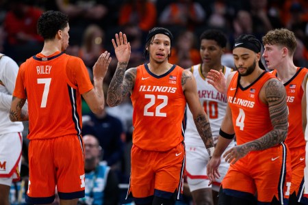 Illinois Fighting Illini guard Tre White (22) celebrates on the court