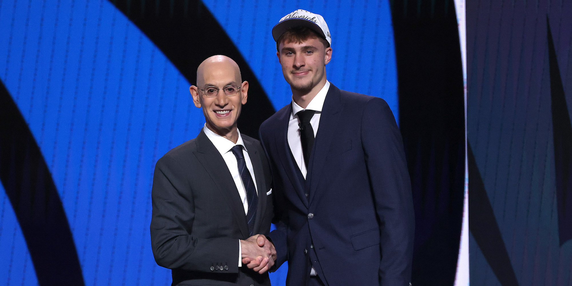 Cooper Flagg shakes hands with NBA Commissioner Adam Silver, as he becomes the youngest first overall pick since LeBron James in 2003